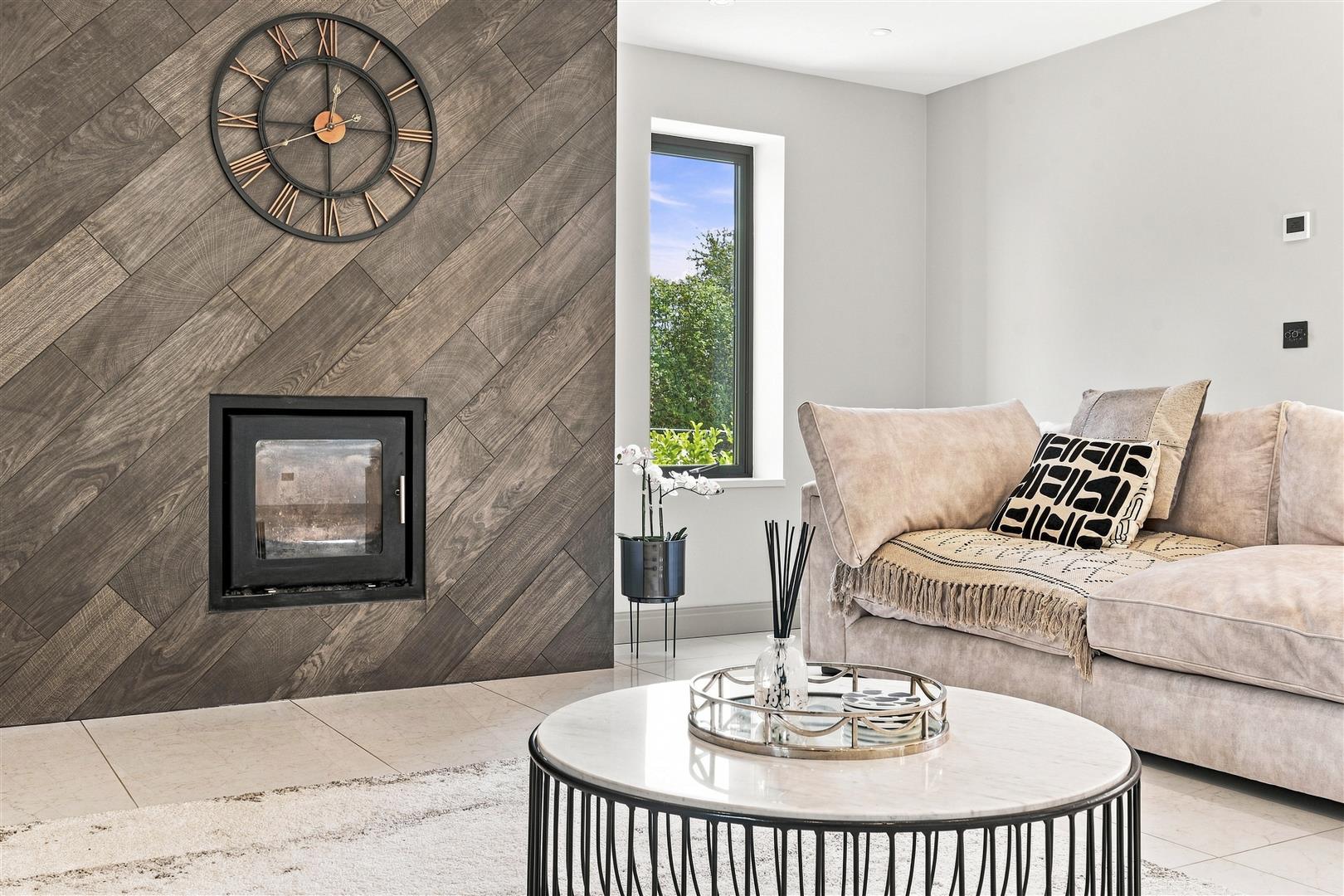 The formal lounge at Round Top Barn, with a feature log-burner